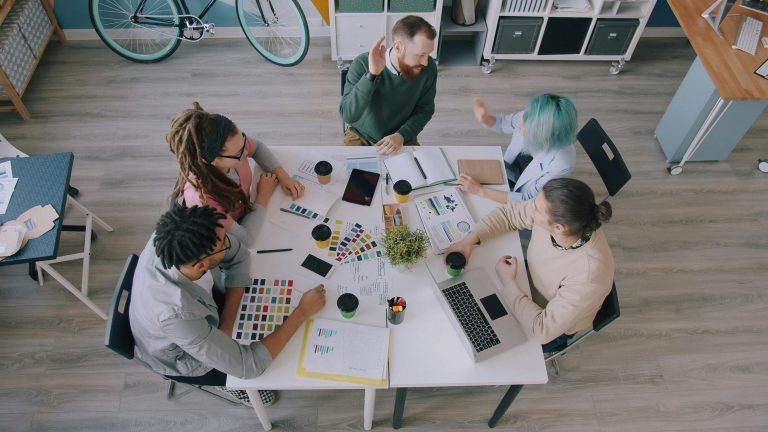 A group of coworkers sitting around a table